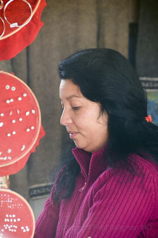 20071218 104041 D2X 2800x4200.jpg - Lady at one of the local kiosks, Coyhaique, Chile